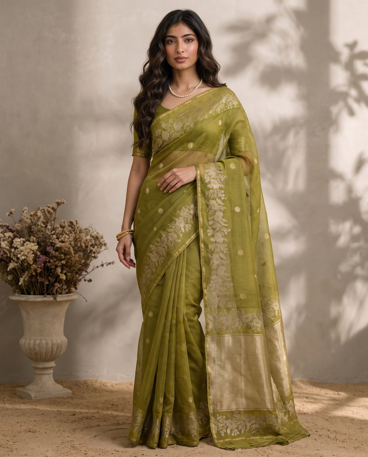 Full drape front view of olive green pure Manipuri Kota saree