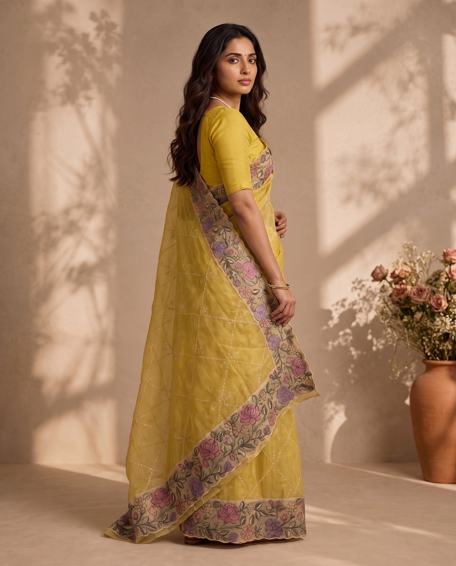 Three-quarter view of yellow pure kota silk saree drape
