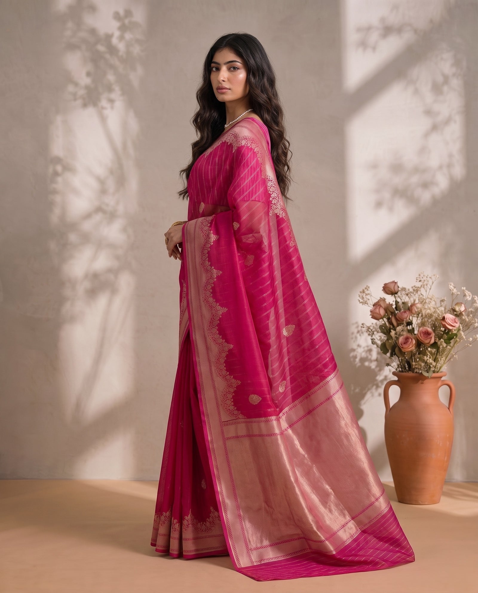Three-quarter drape of pink pure kora organza saree