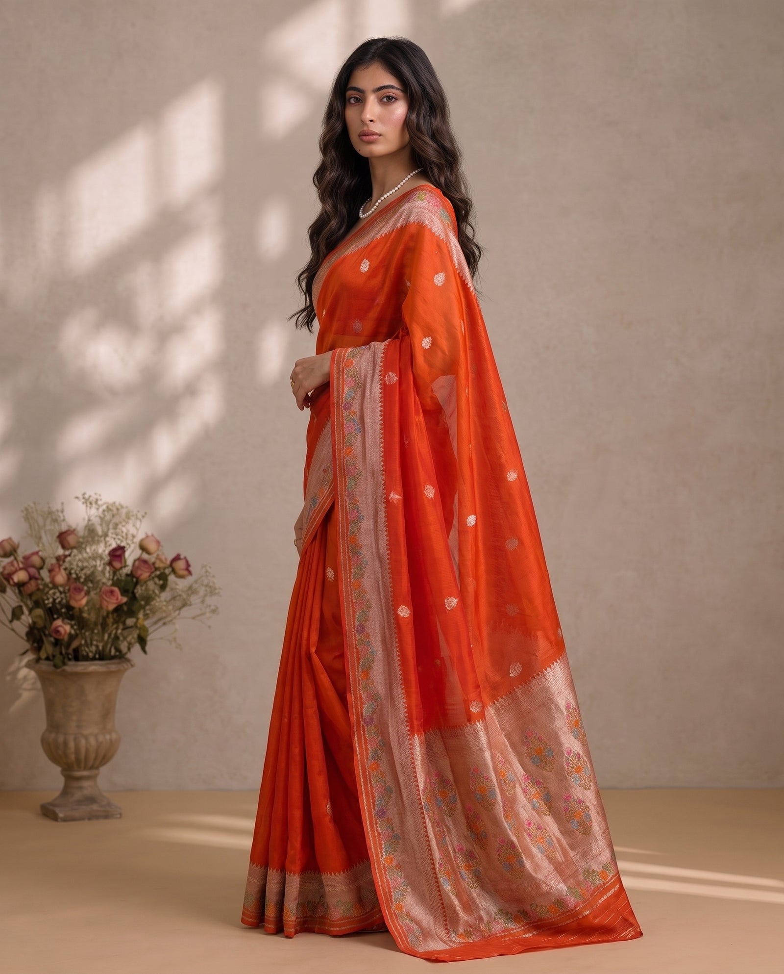 Three-quarter view of orange pure kora saree showing drape and fall