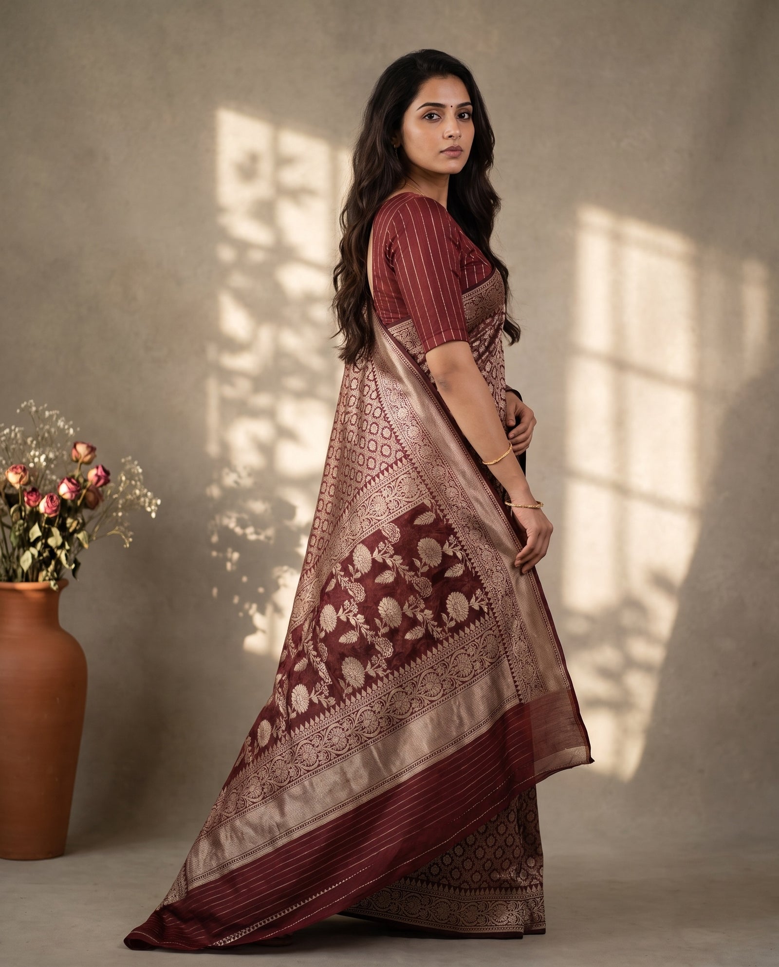 Three-quarter view of maroon pure kora Banaras saree with zari weaving