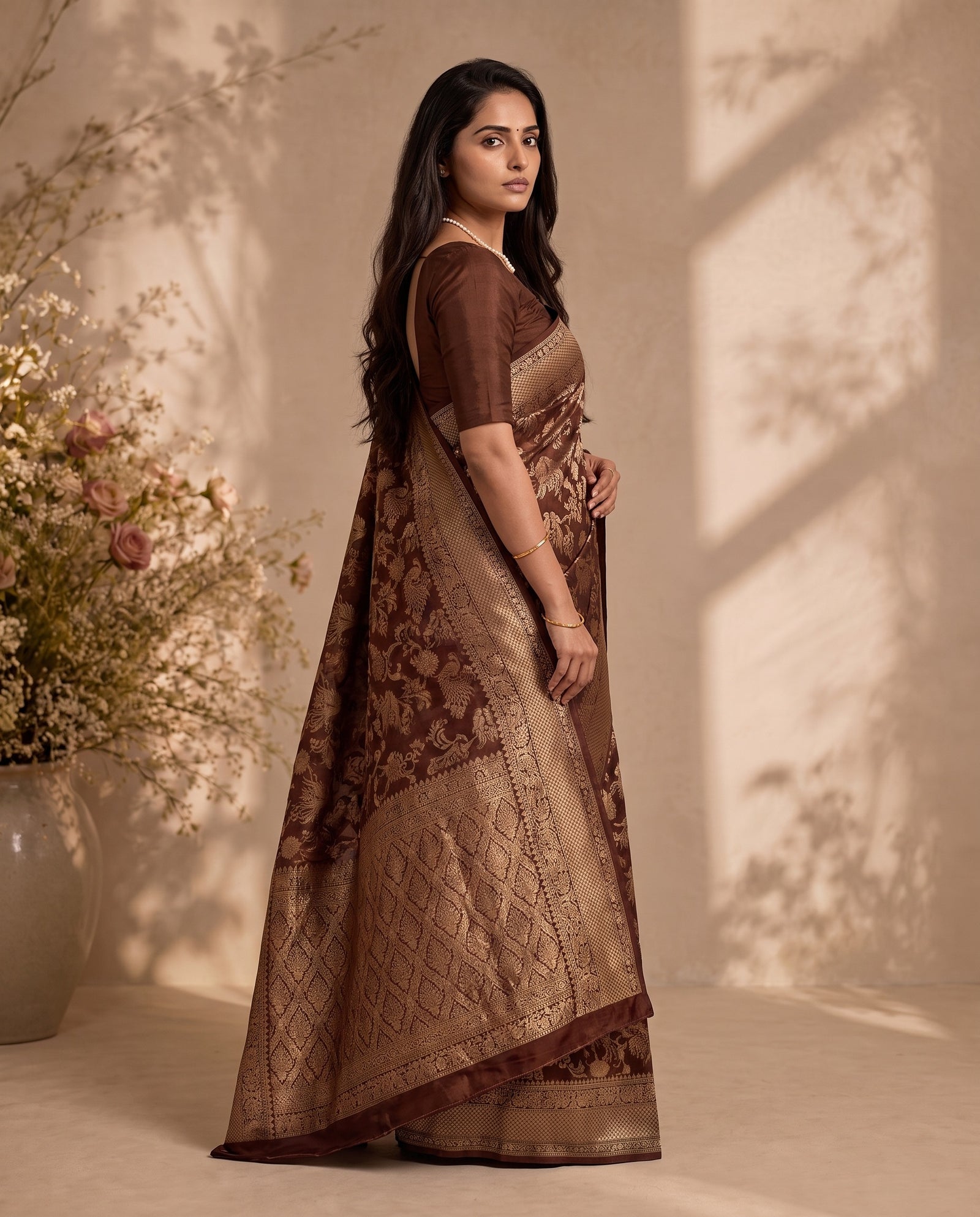 Three-quarter drape view of chocolate brown pure HO silk saree