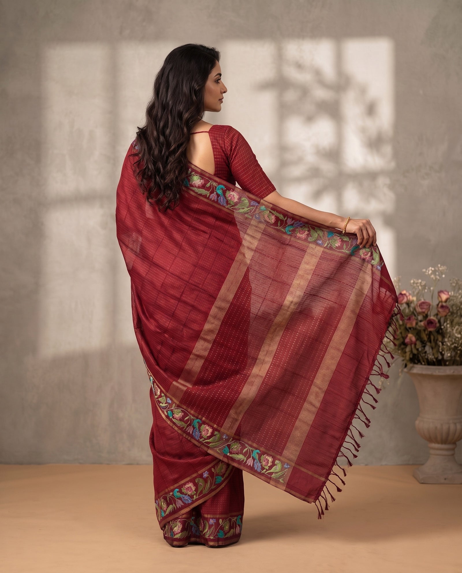 Three-quarter view of deep pink pure Kosa Tussar saree
