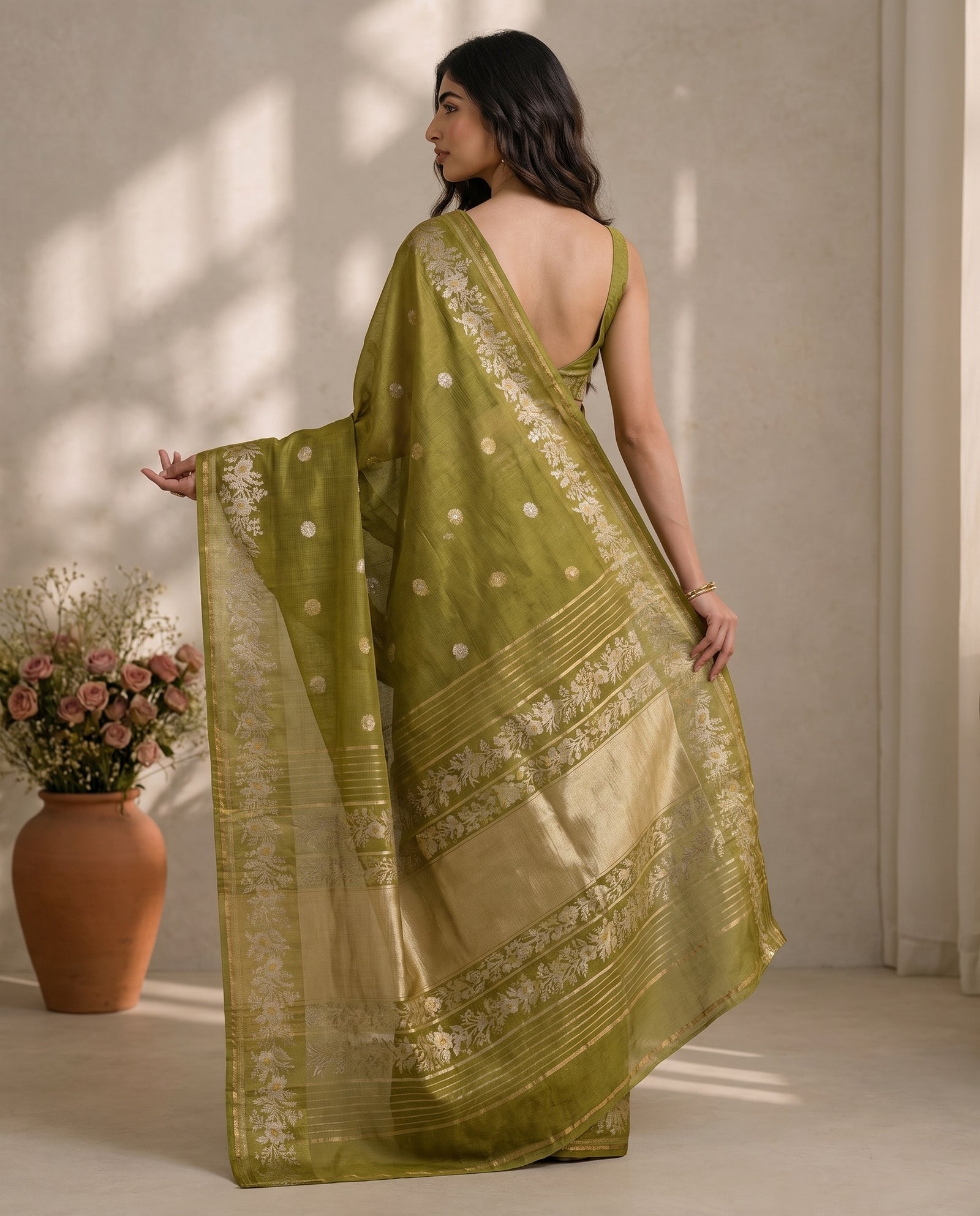 Three-quarter drape of olive green pure Manipuri Kota saree