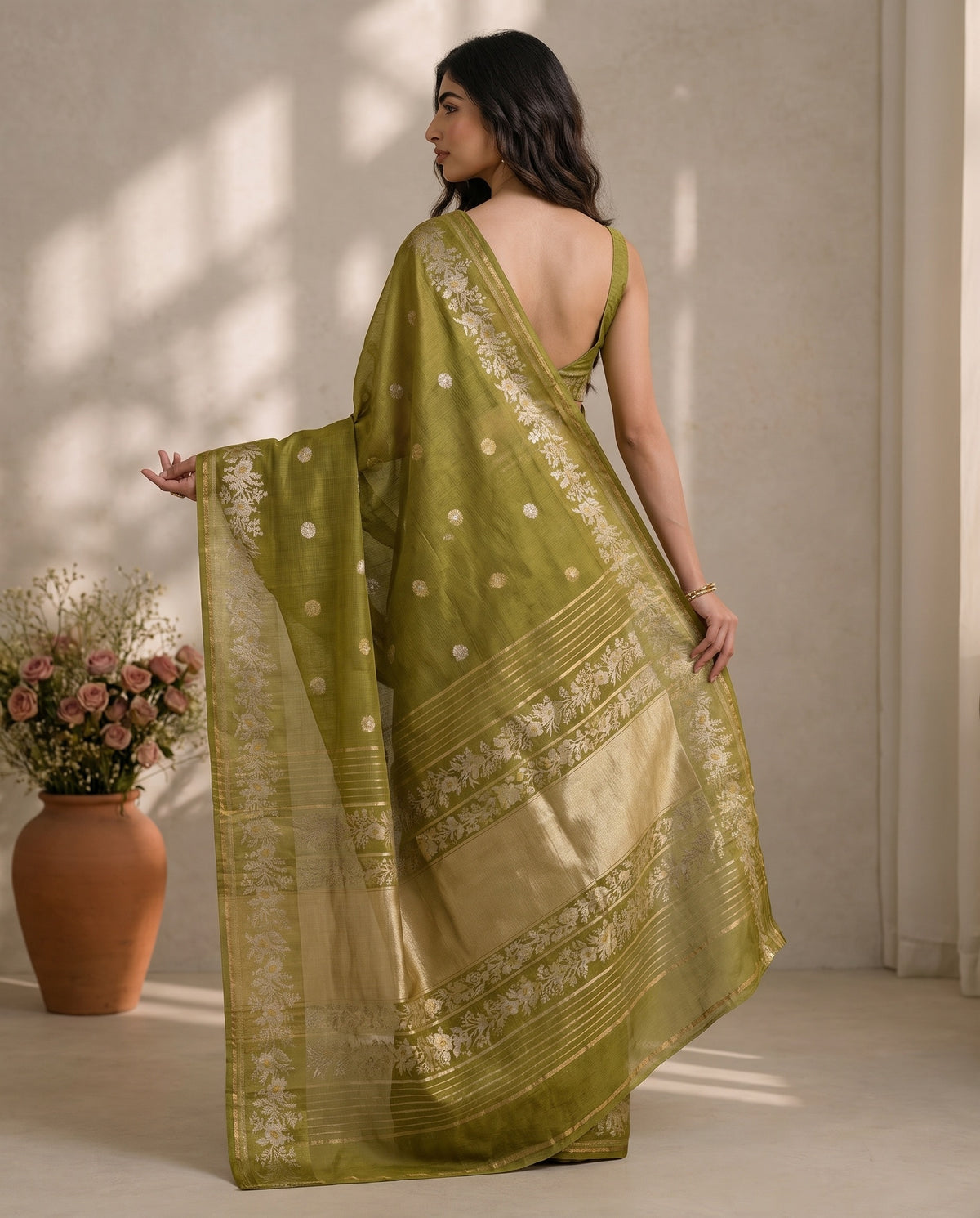 Three-quarter drape of olive green pure Manipuri Kota saree