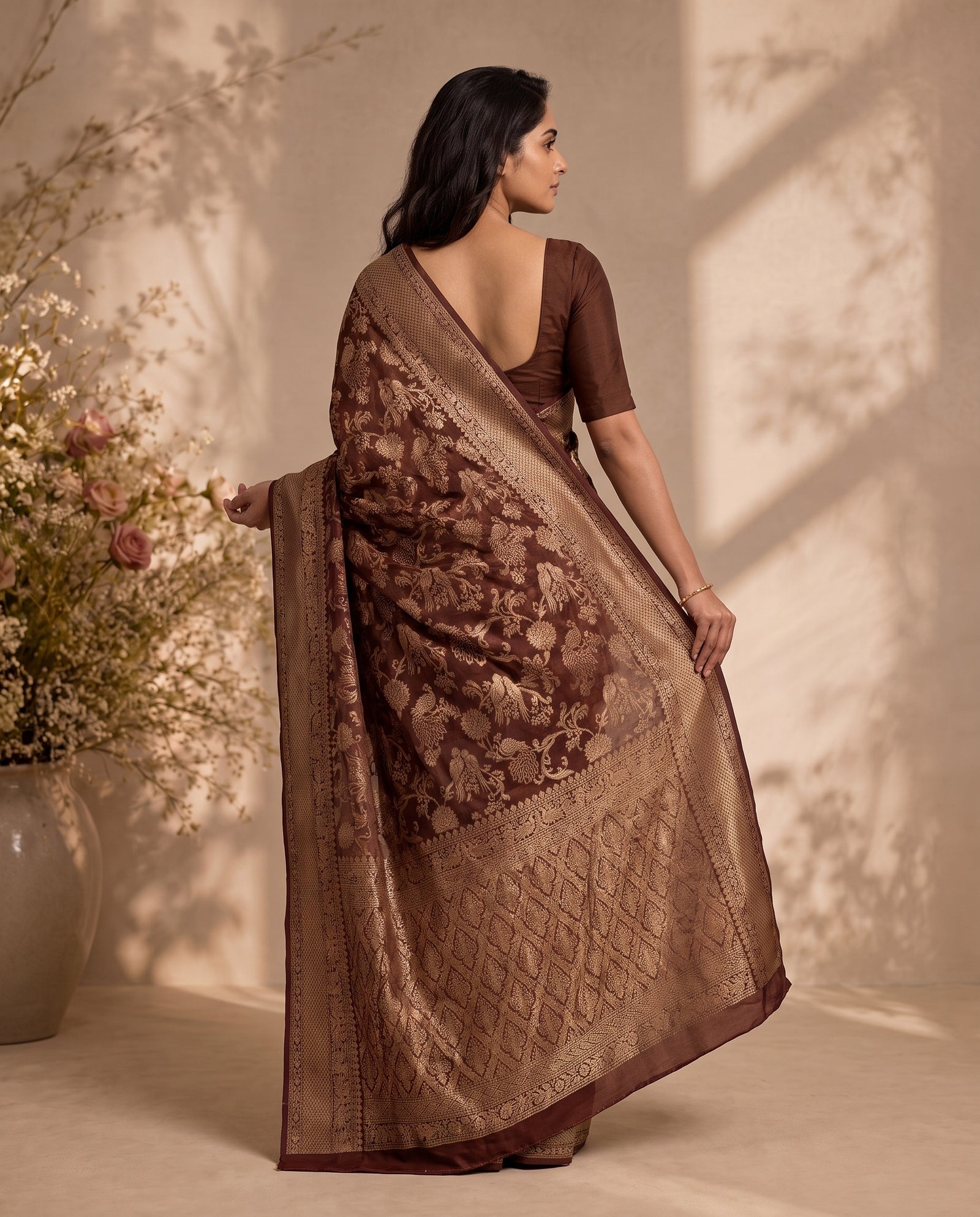 Back drape view of chocolate brown pure HO silk saree