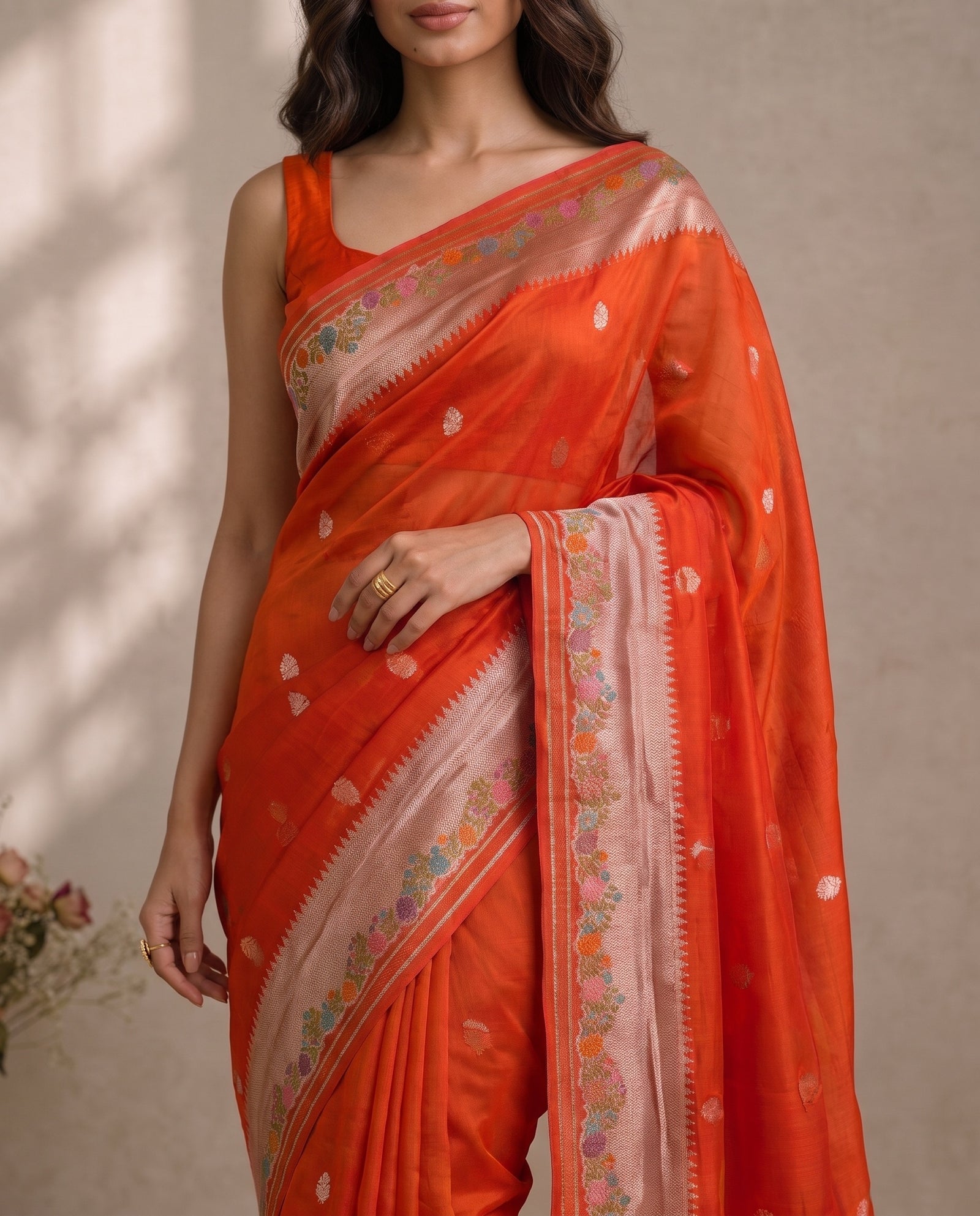 Back view of orange pure kora meenakari saree drape
