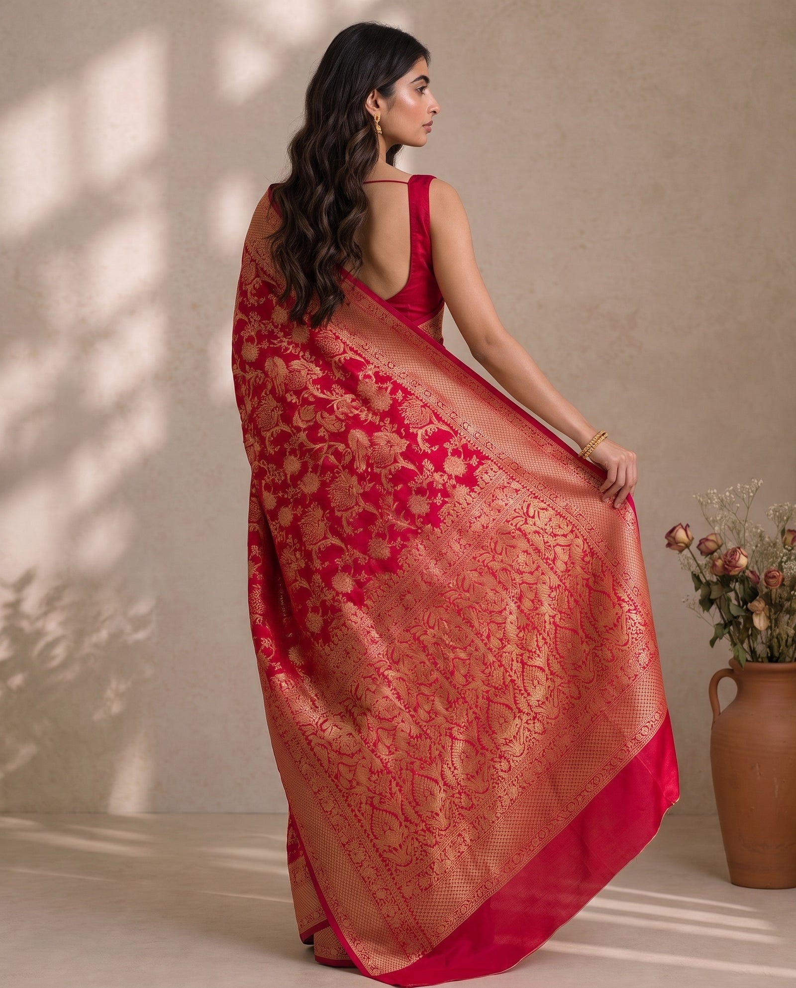 Mid-body crop showing woven bird motifs on Mirchi Red silk