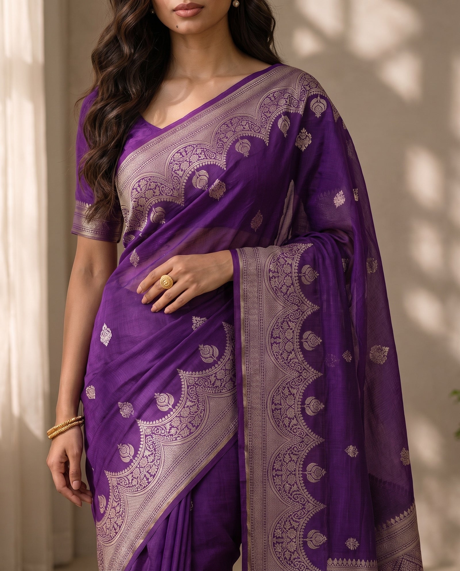 Mid-body crop showing purple fabric and woven butta motifs