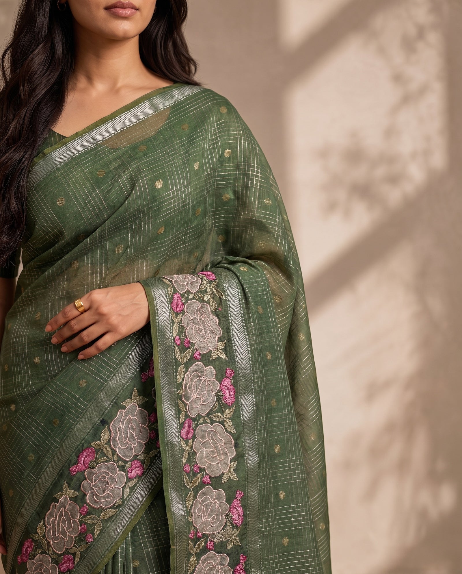 Mid-body detail of green cotton saree with woven checks