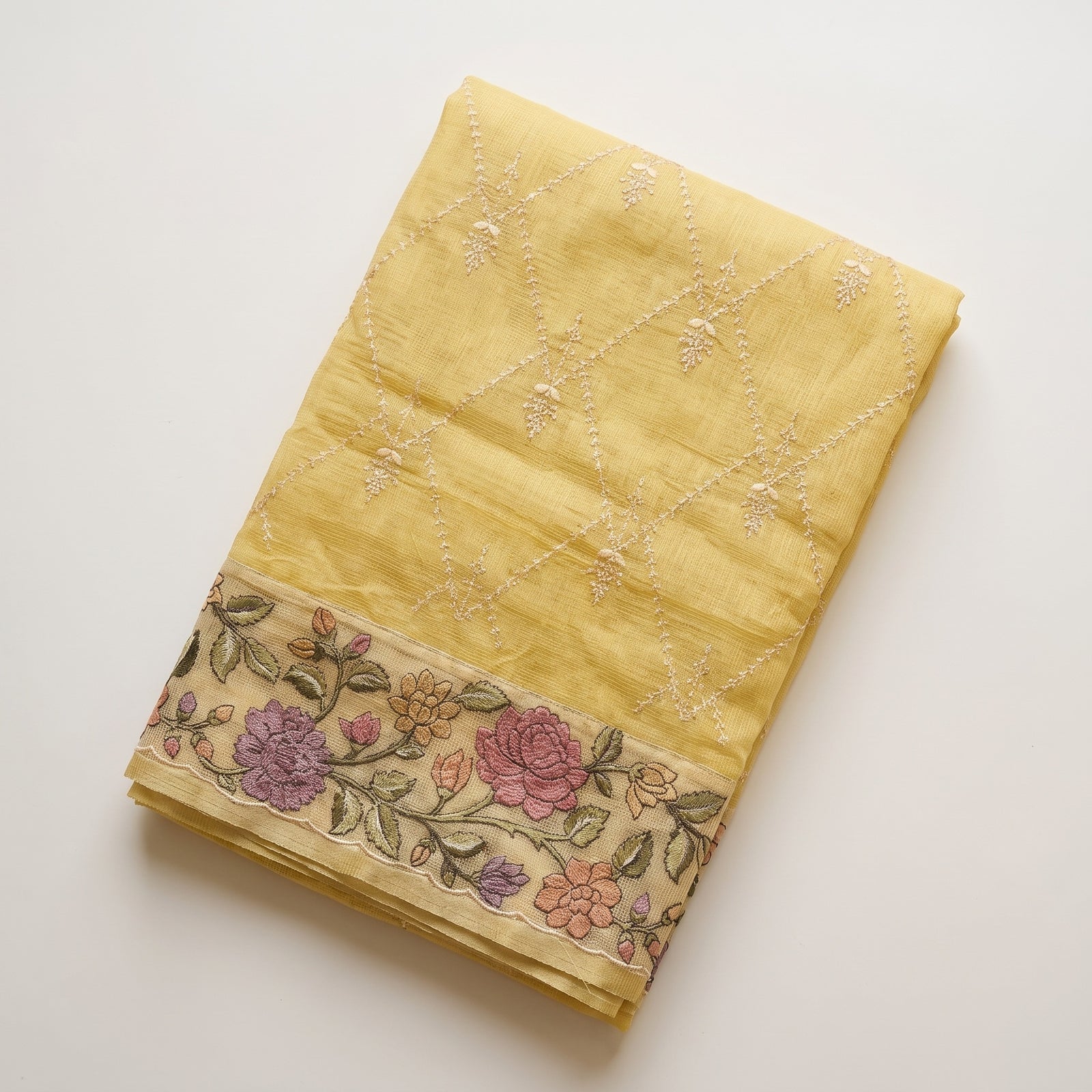 Mid-body crop showing diamond thread embroidery on yellow kota silk
