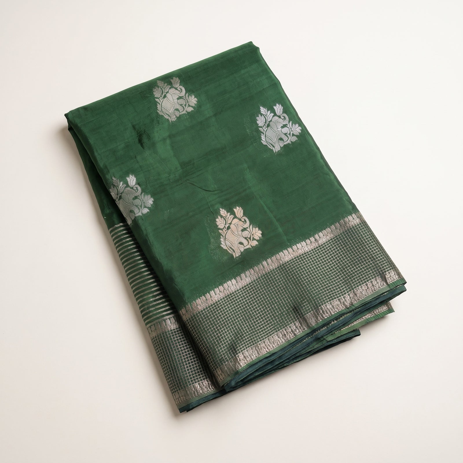 Mid-body view of green pure HO silk saree showing woven motifs