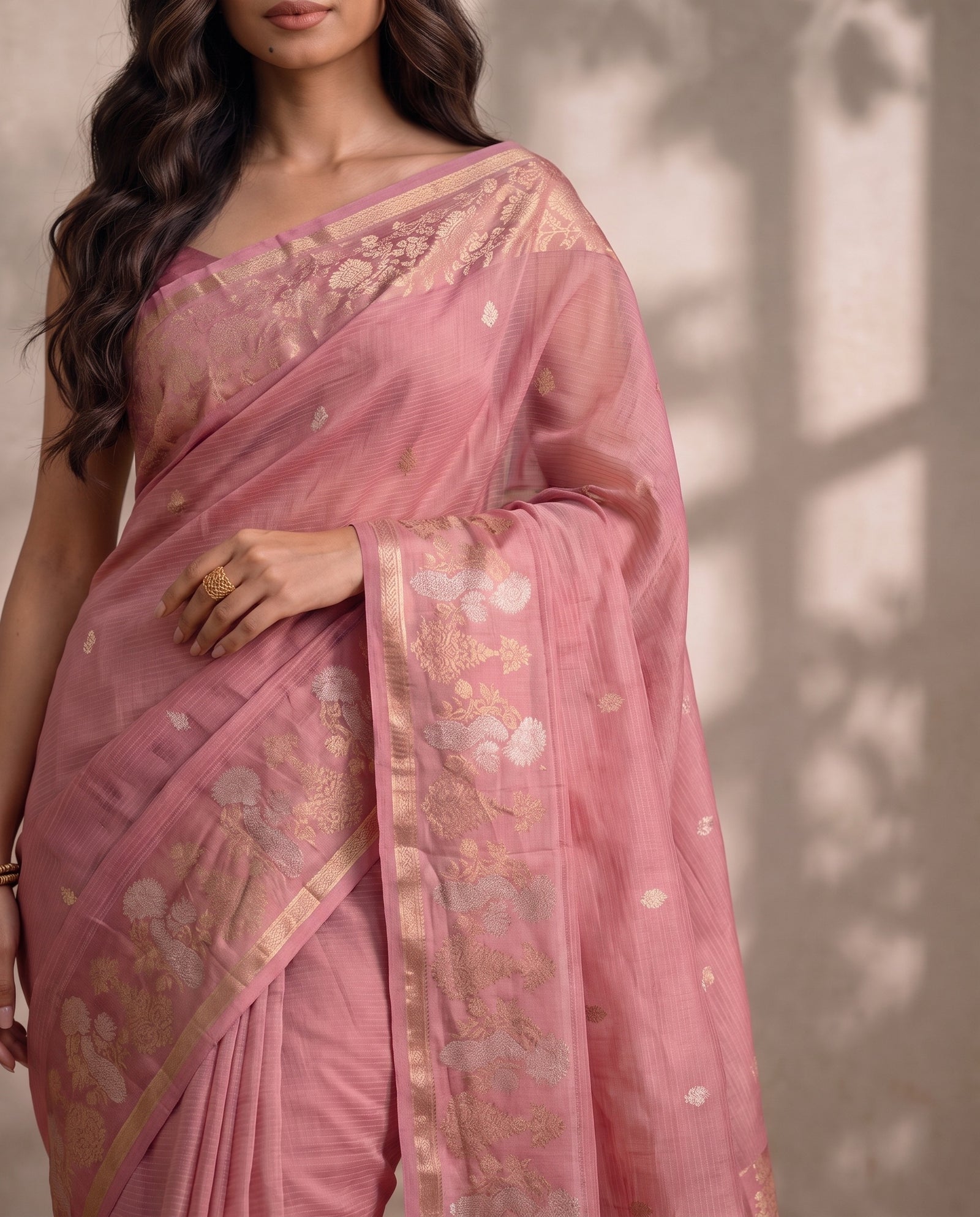 Pallu draped over the shoulder showing woven zari details