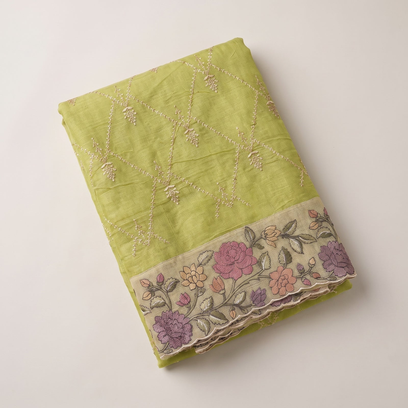 Pallu draped over shoulder featuring multi-colour floral thread work border
