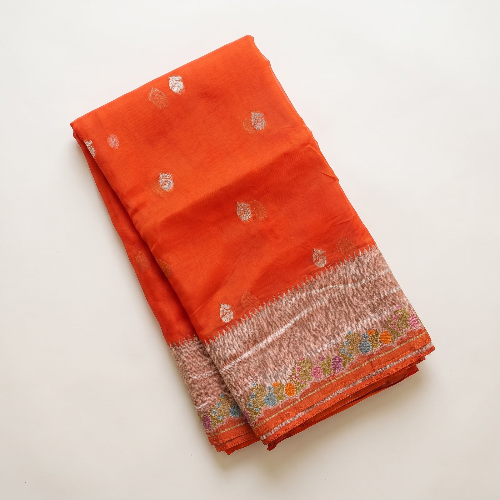 Pallu draped over shoulder highlighting meenakari detailing