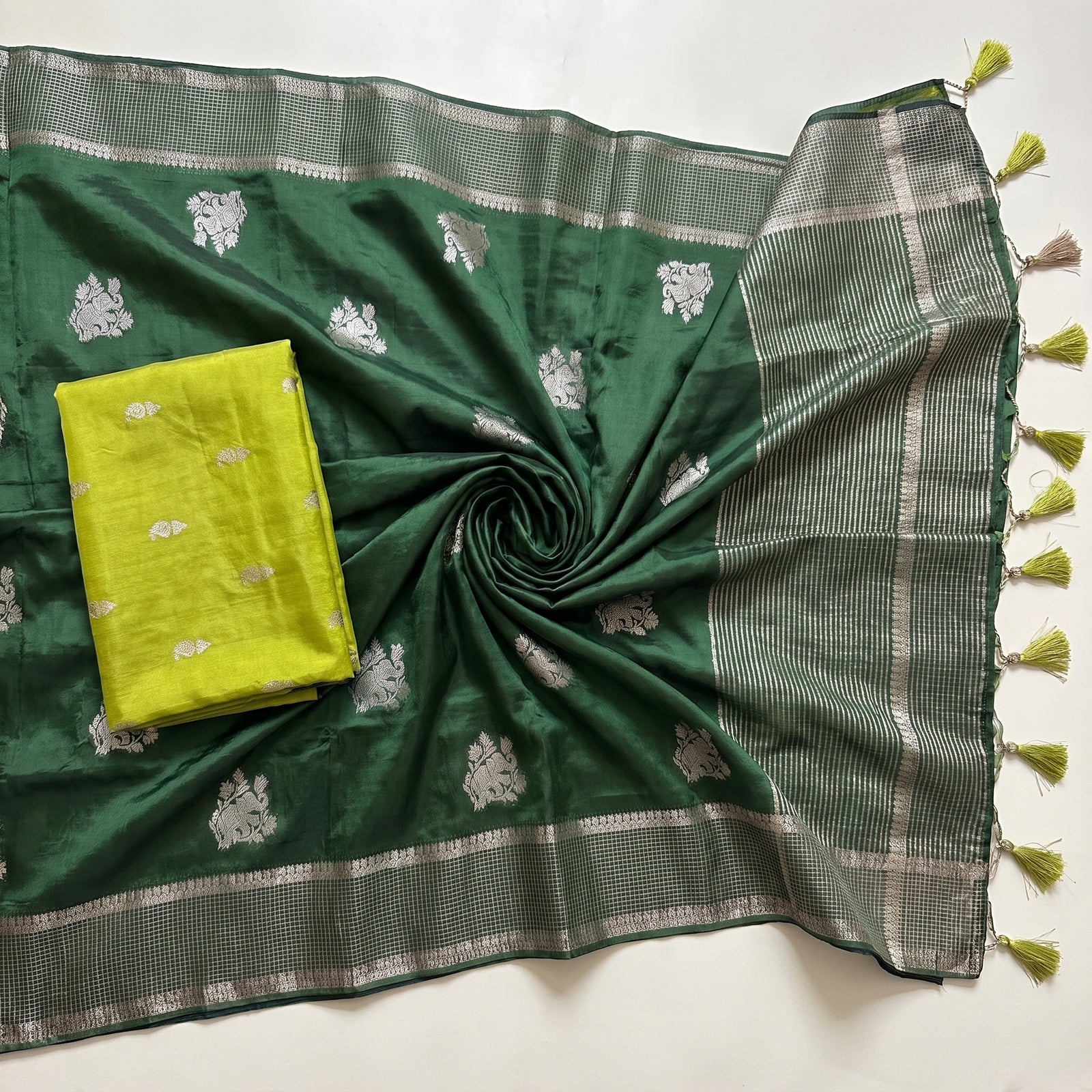 Pallu draped over shoulder of green pure HO silk saree