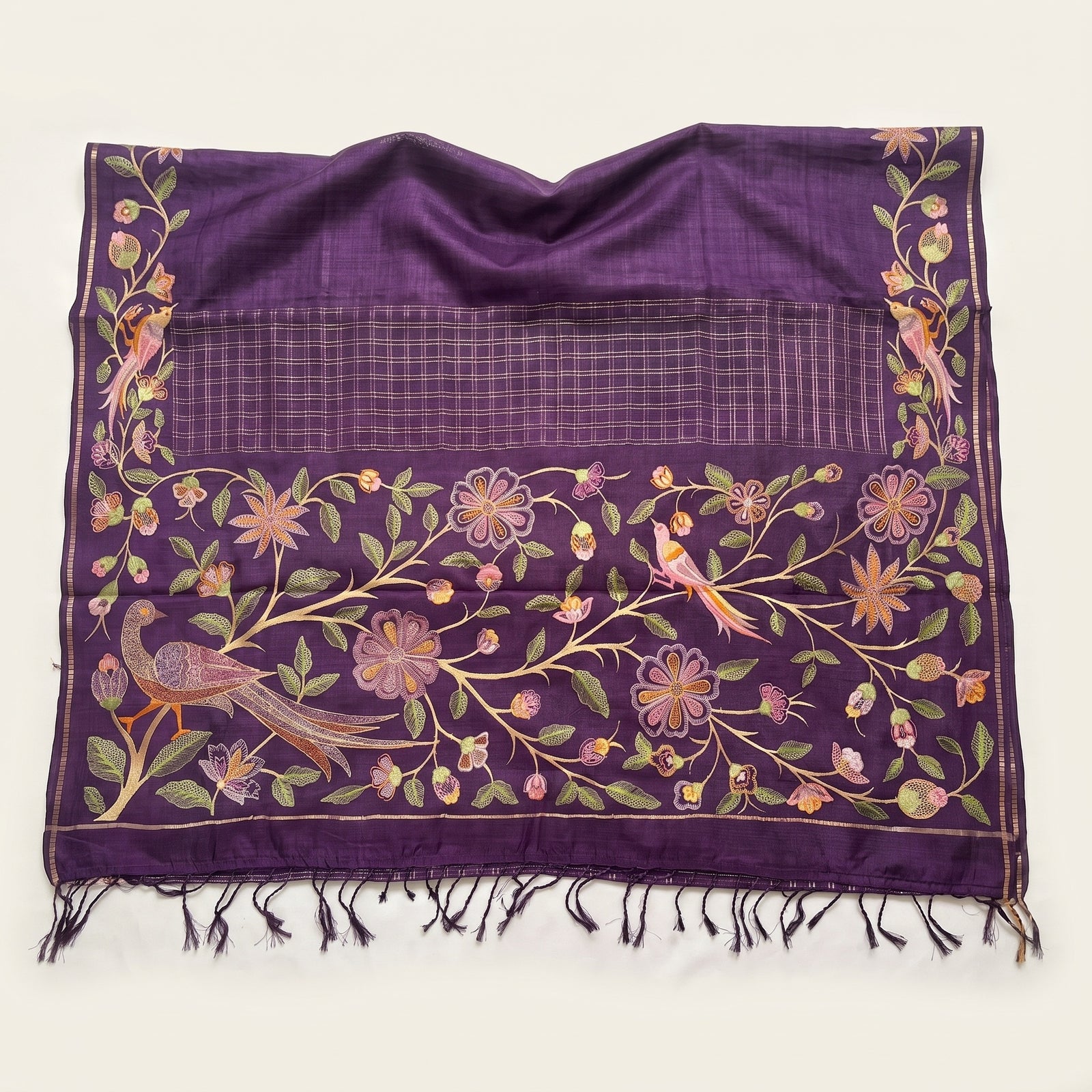 Folded hero shot of purple Pure Tussar saree with bird border motif