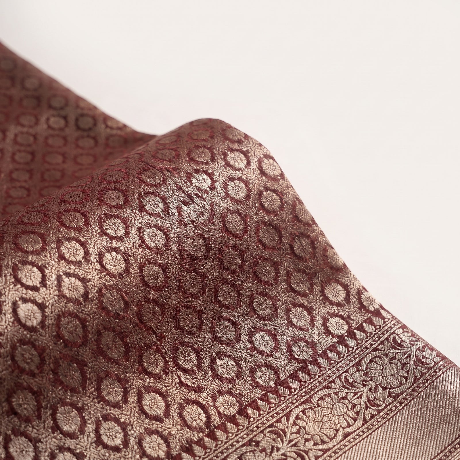 Folded maroon pure kora Banaras saree with zari borders