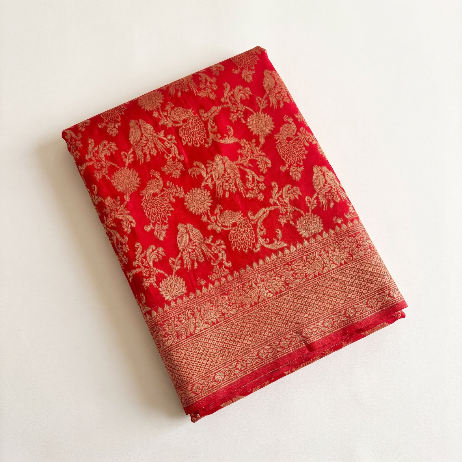 Flat spread of Mirchi Red Pure HO Silk saree body and pallu
