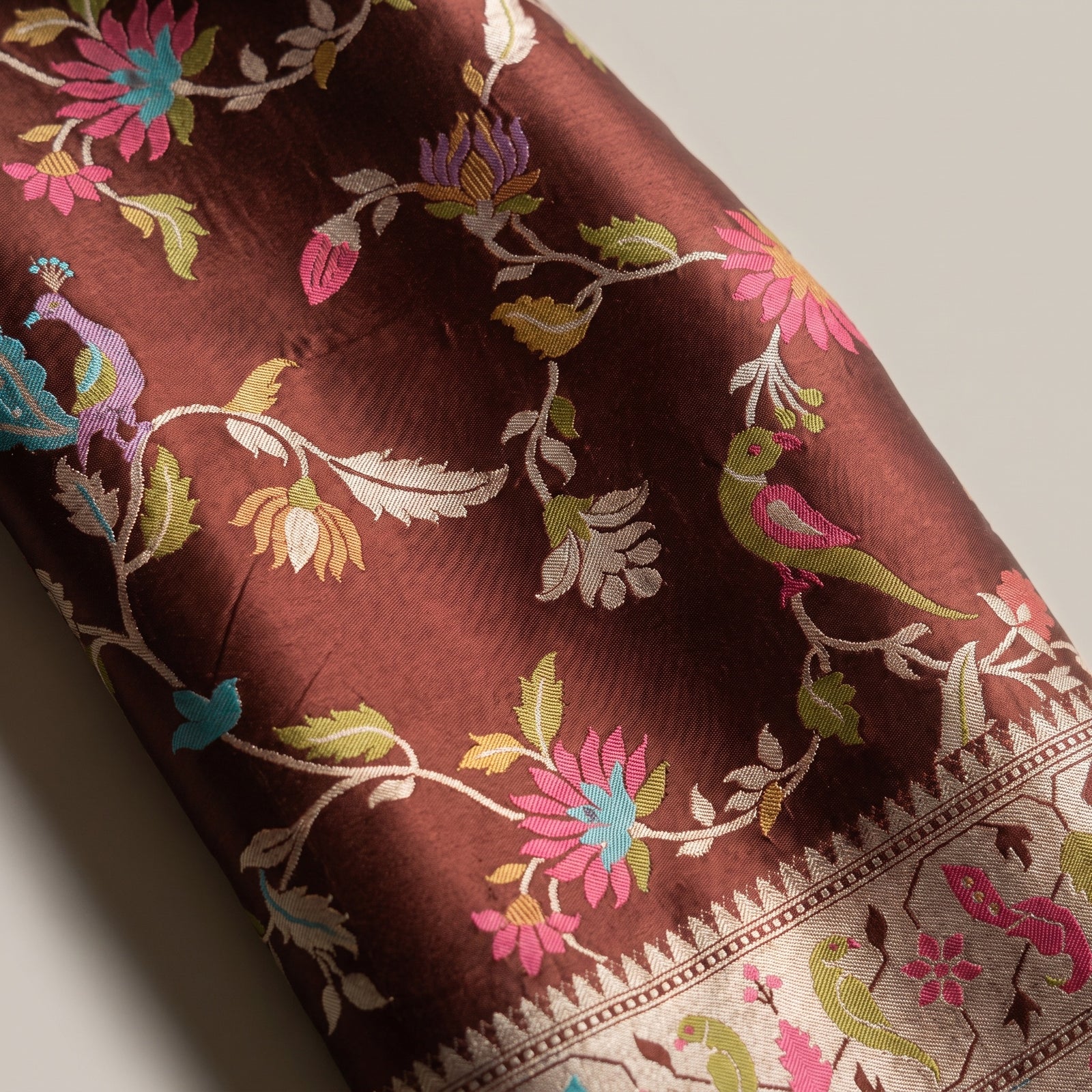 Flat spread showing chocolate brown body and woven motifs