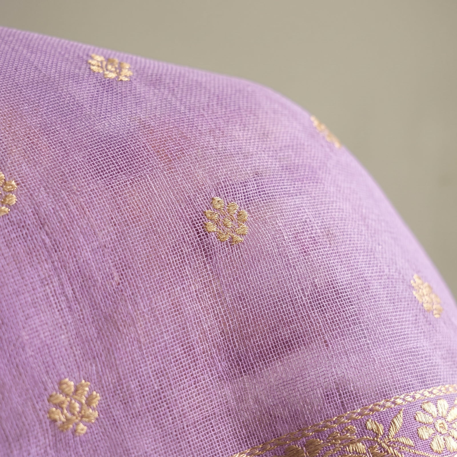 Flat spread of lavender pure Manipuri kota saree showing full pallu and border