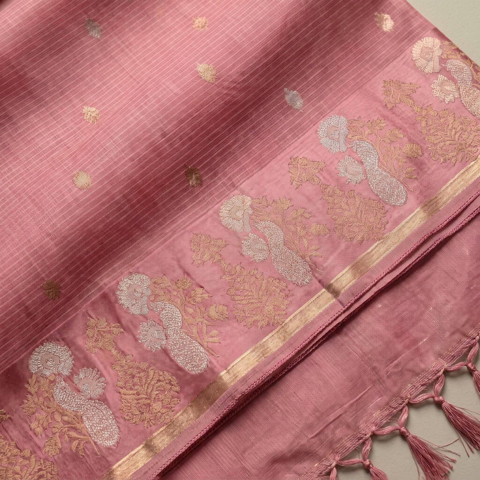 Close-up macro of the intricate zari woven border