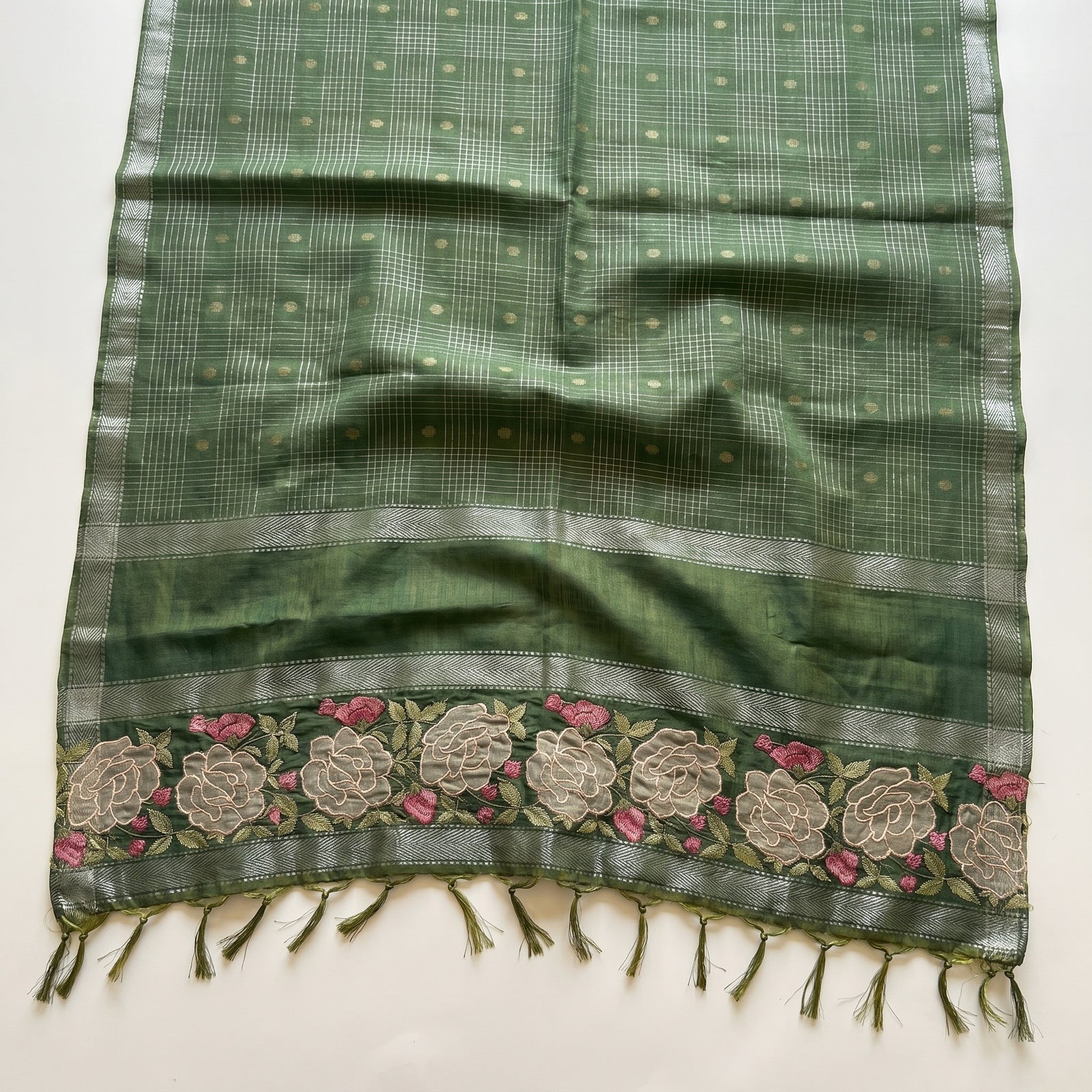 Macro detail of floral embroidered border and zari band