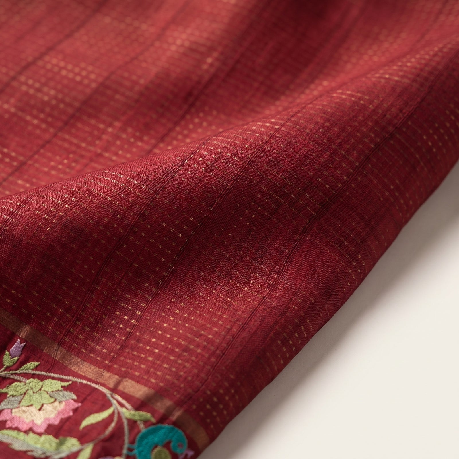 Macro close-up of multicolour floral and bird motif border